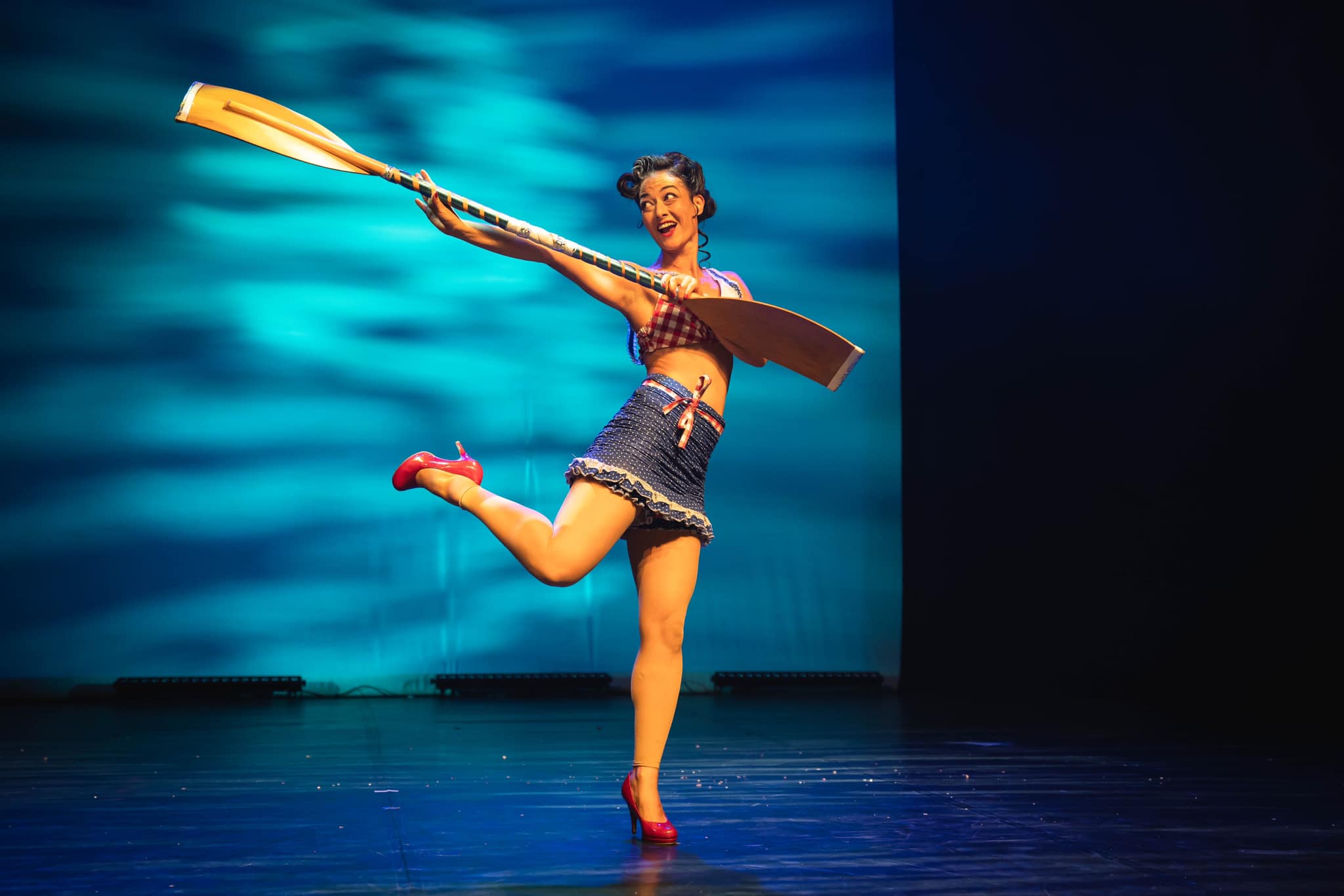 Valerie Sealey performing with a paddle.