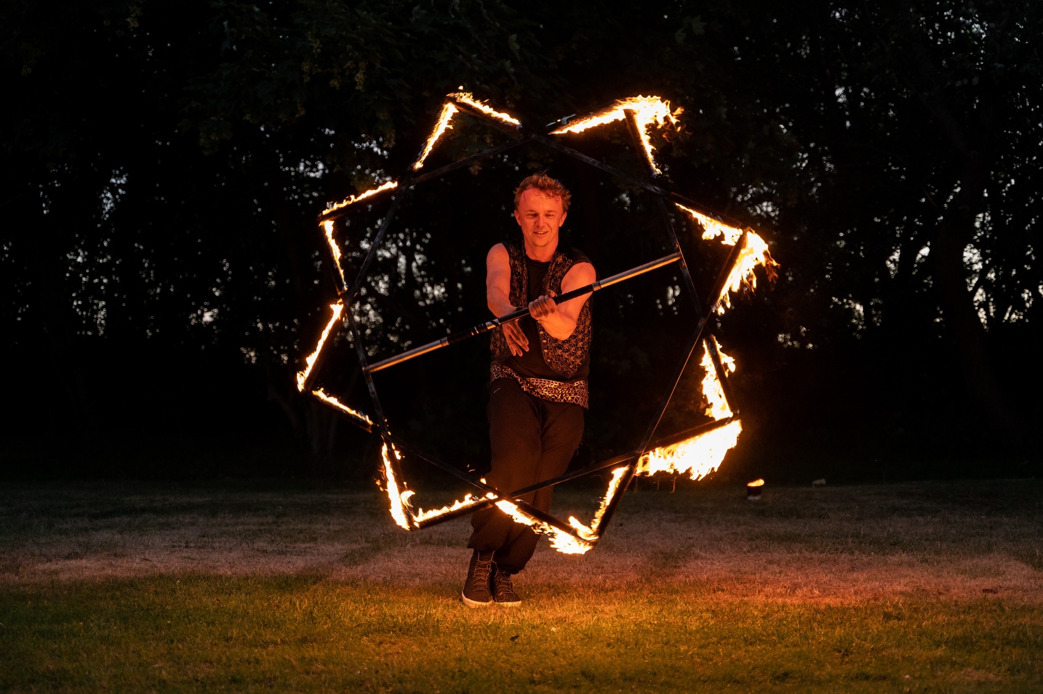 Szymon performing with a fire prop